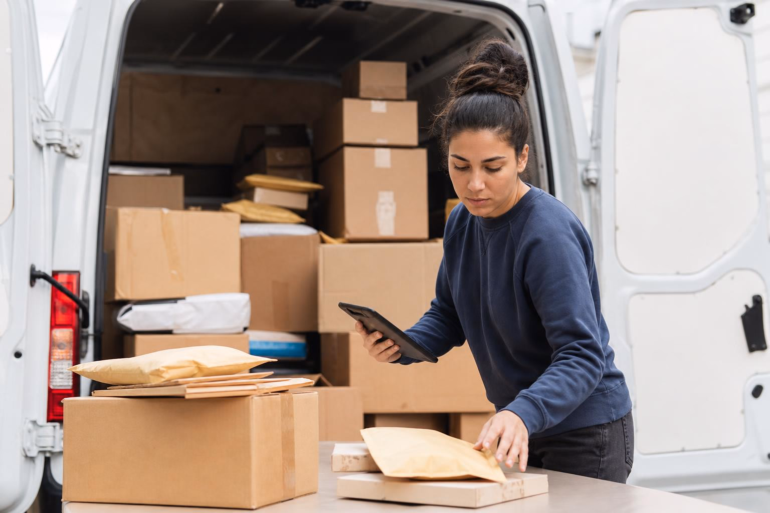 USPS vs UPS for Small Business 2026: Costs, Speed & Fees